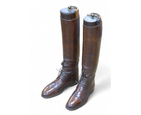 A pair of WWI officer's leather riding boots, both with vintage wooden trees. (2)