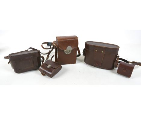 Three vintage cameras, compromising a Wallace Heaton plate camera, a Zeiss Ikon, and a Agifold. (3)