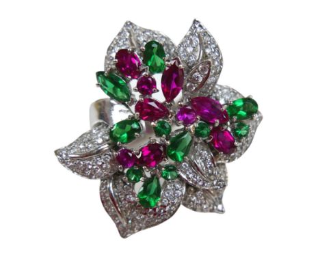 A rhodium-plated silver cocktail ring, set with pink, green and white topaz in a large floral design, marquise, pear and oval