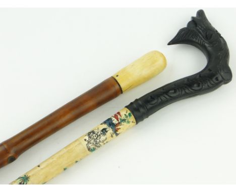 A Bamboo walking cane with ivory handle,
36", & a Chinese bone walking stick with carved wood handle (2)