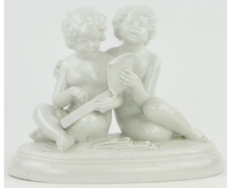 A French porcelain group of 2 children singing,
signed Rezl, circa 1930, height 10".
