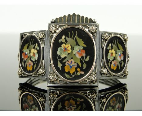 A 19th century pietra-dura bangle,
having 3 inset floral panels, unmarked silver and gold settings, setting height 35mm, larg