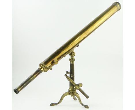 A Victorian brass telescope,
on original brass tripod, length including extension eye piece 48".