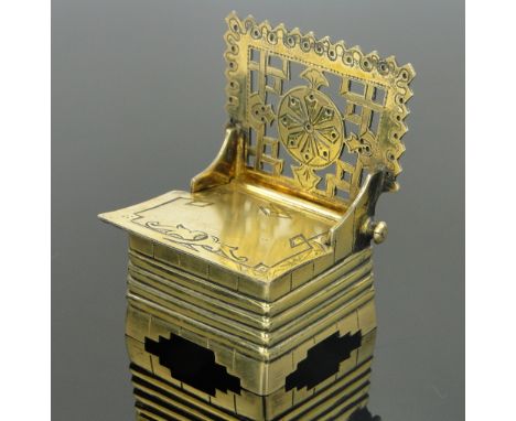 A 19th century Russian silver gilt trinket box in the form of a chair,
with rising seat, makers marks K B, marked 84, height 