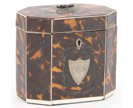 A 19th century tortoiseshell & ivory tea caddy,
of canted rectangular form with unmarked silver swing handle, ex property of 