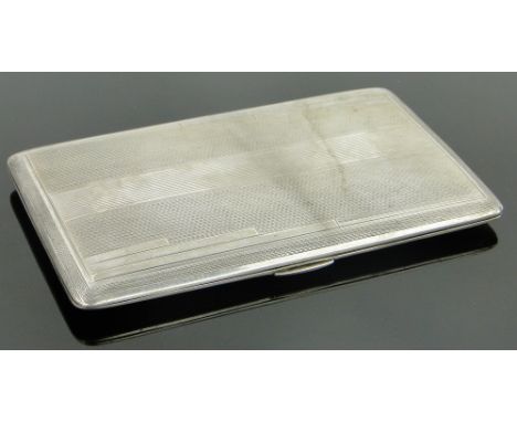 An Art Deco engine turned silver cigarette case,
length 14cm.