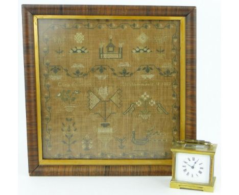 A brass carriage clock, and a sampler dated 1887, 
framed, height 15" overall.