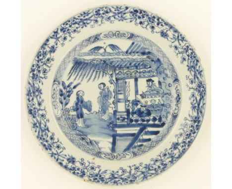 A Chinese blue & white porcelain plate, 
with painted figures in gardens, 9.25" across