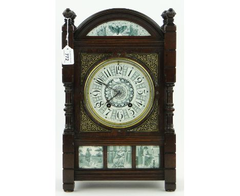 A Victorian mahogany dome-top 2-train bracket clock,
decorated with ceramic dial and panels, dial reads "Imported by Howell J
