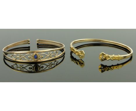 A 9ct gold opal set bangle,
and a 9ct gold buckle design bangle, 13g gross.