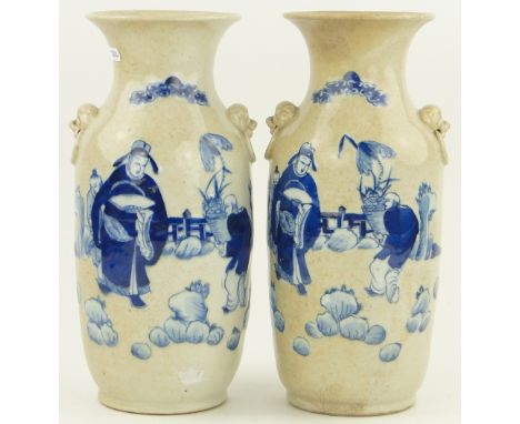 Pair of Chinese blue and white porcelain vases,
with painted figures in gardens and dragon handles, height 14".