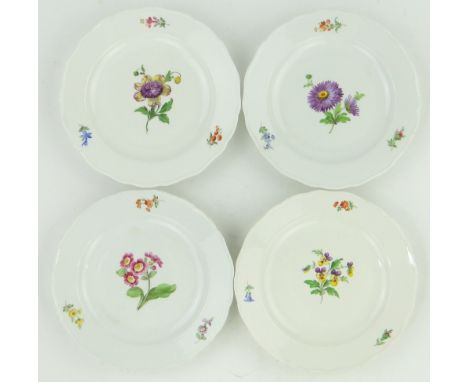 Set of 4 Meissen porcelain plates,
with painted floral designs, 10" across.