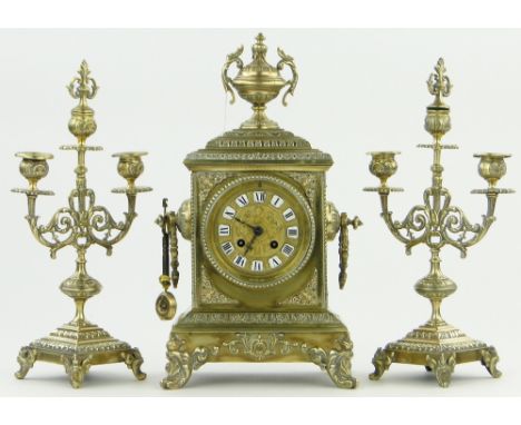 An ornate brass 2-train clock garniture,
clock height 16".