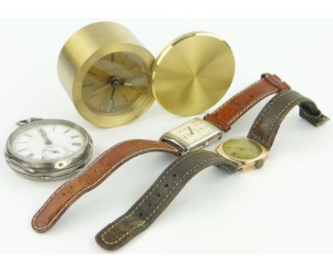 A group of clocks and watches,
including a Tiffany brass cased quartz travelling clock, a Jaeger Le Coultre Reverso wristwatc