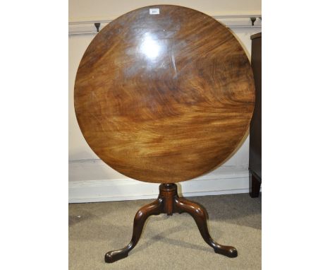 A George III mahogany tilt top tripod table,
width 2'7", height 2'6".