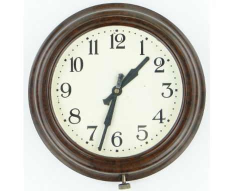 A Bakelite cased wall clock,
diameter 11" overall.