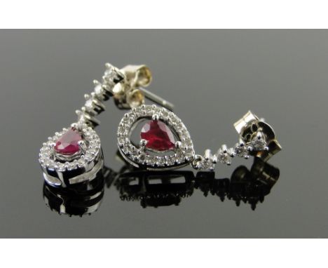 Pair of 18ct white gold ruby and diamond drop earrings,
length 17mm.