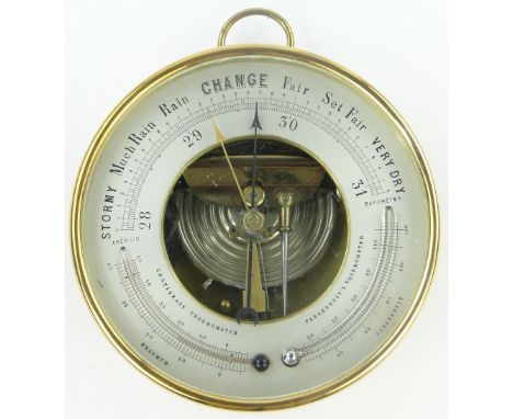 A brass cased aneroid barometer,
6.5" across.