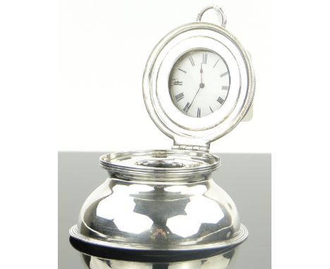 An Edwardian circular silver inkwell,
the hinged lid enclosing a keywind pocket watch, by C Vickery, hallmarks London 1904, 8