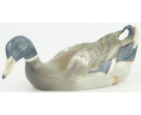 A Lladro porcelain swimming duck,
length 13".