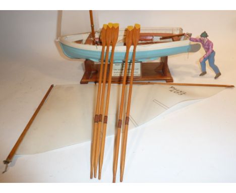 Plastic and Wooden Kits and Models a professionally made wooden sailing dinghy approx. 1/12 scale and a nicely made wooden LC