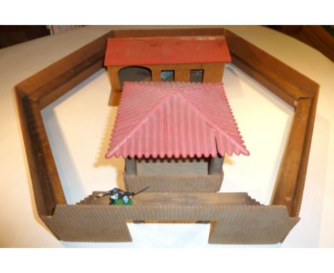 A Wild West Army Outpost wood and hardboard with stockade, stable and lookout with plastic roof, a repainted Airfix landing c