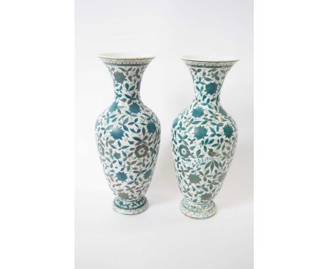 Pair of continental porcelain vases decorated in green enamel with foliage and birds (repair to neck of one), 26cm high