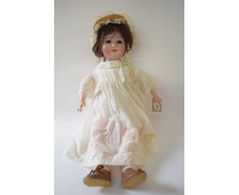 Bisque headed doll by William Goebel, marked 120, in original clothing