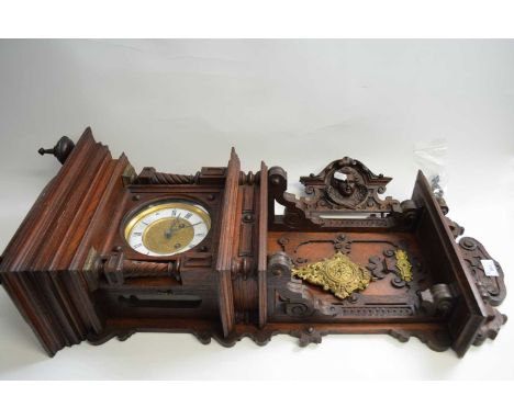 Late 19th Century German wall clock with elaborate architectural oak case with figural pediment, barley twist pillars and car