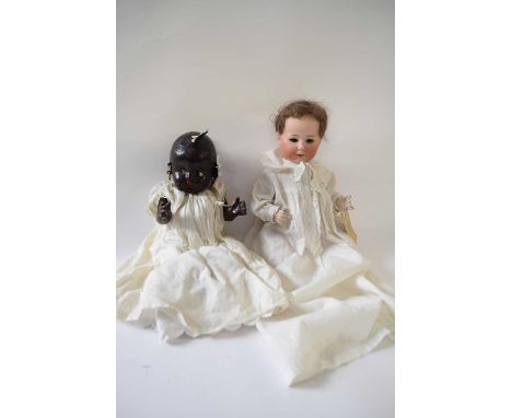 Two further dolls, one with a Heubach bisque head, the second doll marked Reliable Doll Company, made in Canada