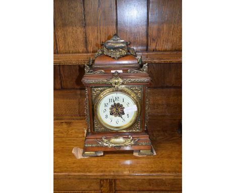 Late 19th Century bracket or mantel clock, the architectural hardwood case with extensive applied metal mounts, pierced grill