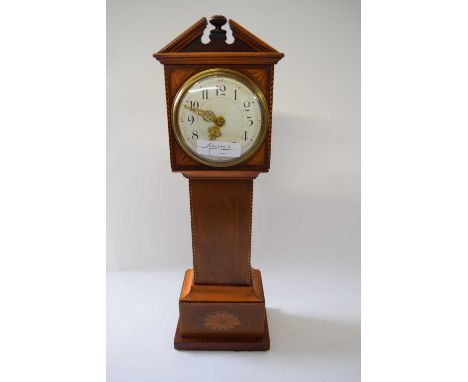 Small model of a long case clock with inlay together with a brass carriage clock