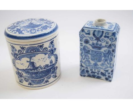 Delft jar and cover, 20th Century together with a Delft tea caddy with floral design and birds (2)