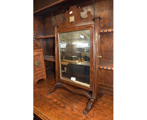 19th Century swing dressing table mirror with shaped pediment and applied carved detail, 69cm high