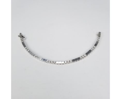 14K White Gold & Diamond Tennis Bracelet. This beautiful white gold bracelet is set with 24 round brilliant cut diamonds each