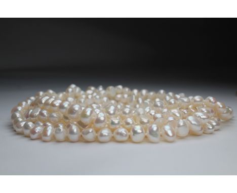 100 inch Strand of White Freshwater Pearls. This strand of pearls ranges from 9-10 mm in size. - All silver, gold and/or jewe