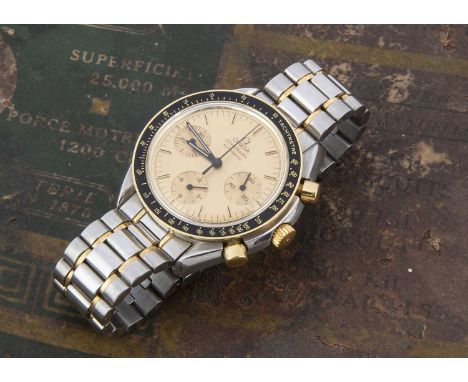 A modern Omega Speedmaster Automatic stainless steel wristwatch, 39mm case heightened with gold and black bezel, gilt dial wi