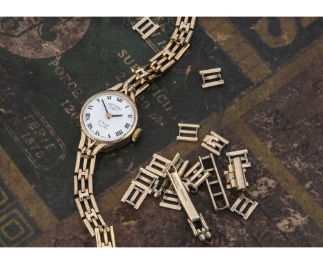 A c1970s Rotary 9ct gold lady's wristwatch, 18mm case with 9ct gold bracelet, 13.3g, together with several spare links and a 