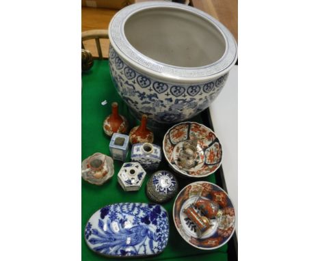 A collection of Oriental china wares to include blue and white jardinier, two Imari bowls on wooden stands, various vases, bl