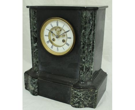 A Victorian black slate and marble cased mantle clock with visible escapement