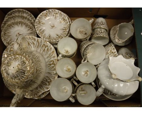A 19th Century gilt decorated part tea service