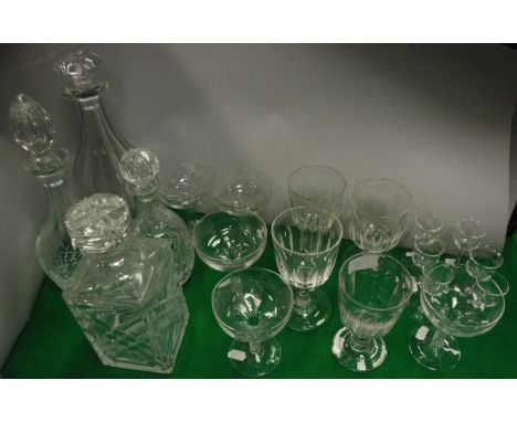 Four various decanters and stoppers, five champagne saucers with hollow stems, six liqueur glasses and four various wines CON