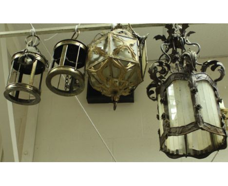 A metal and glass hall light with acanthus leaf decoration, together with a similar brass and glass example and a pair of bra