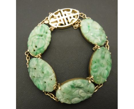 A Chinese 14 carat gold mounted jade bead bracelet with five oval carved stones CONDITION REPORTS Appears to be in good condi