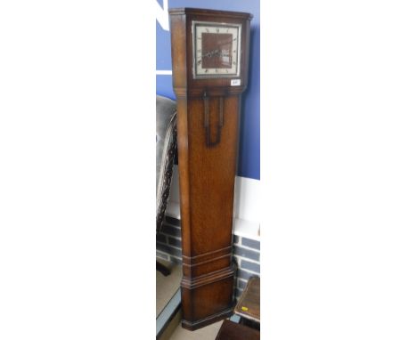 An art deco style oak case corner clock