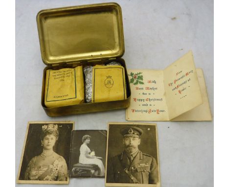 A embossed brass Mary Christmas box containing Christmas card, cigarettes, "Best wishes for Christmas 1915, may God protect a