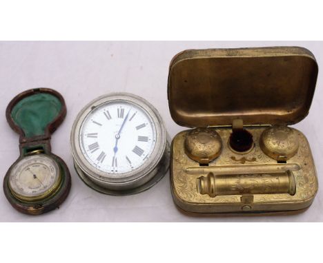 A Victorian leather covered gilt and brass travelling inkwell with two inkwells, candle and brush, together with a leather ca