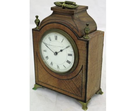 A 19th Century mahogany cased mantle clock, retailed by Manoah Rhodes & Sons Ltd of Bradford, with Roman numerals to the enam