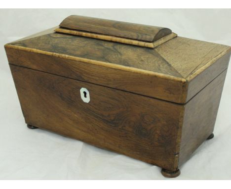A Regency rosewood tea caddy of sarcophagus form
