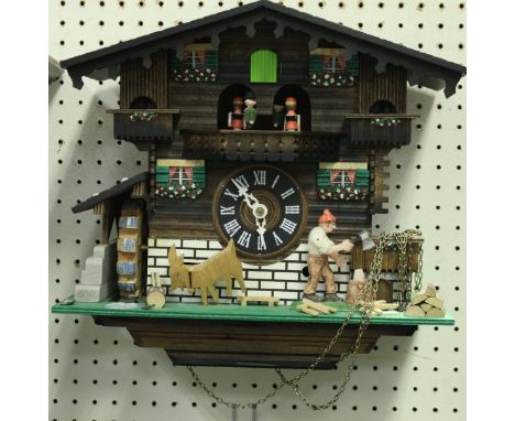 A modern painted wooden "Cuckoo" clock, the Swiss movement playing "Edelweiss" and "Lara's Theme" from "Dr. Chivago" CONDITIO